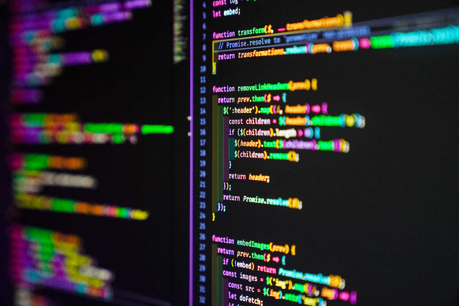 A blurred background with focused lines of colorful programming code from top cybersecurity programs in Virginia displayed on a computer computer screen.